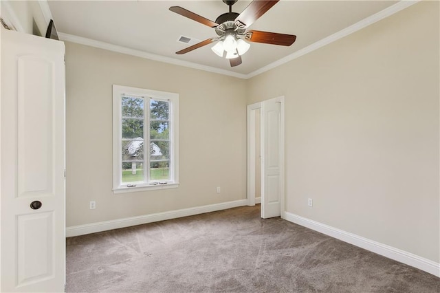 unfurnished bedroom featuring crown molding, light carpet, and ceiling fan