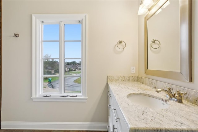 bathroom with vanity and a wealth of natural light