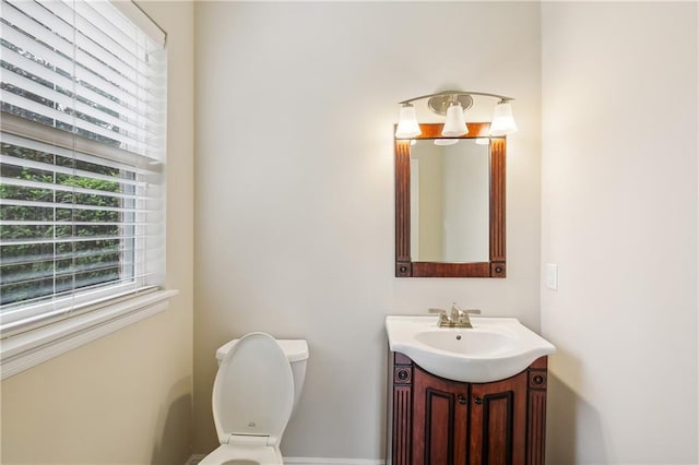 bathroom with toilet and vanity