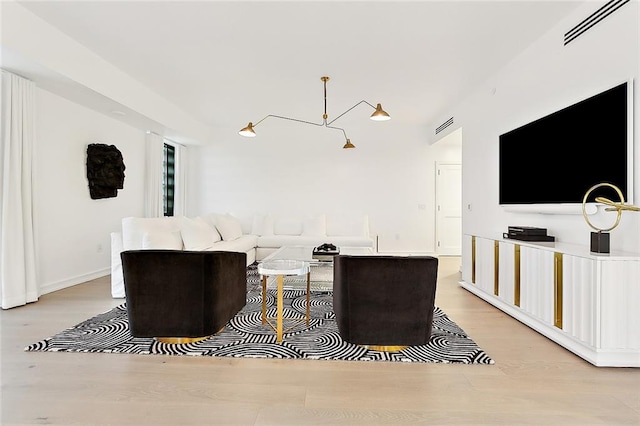 living room with light hardwood / wood-style floors