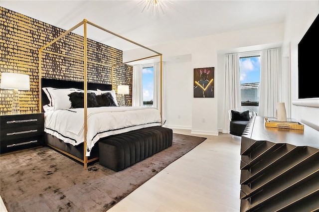 bedroom with wood-type flooring