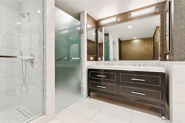 bathroom with vanity, a shower with shower door, and tile patterned flooring