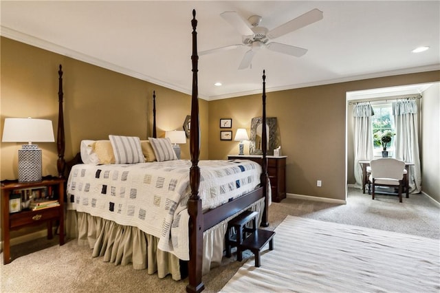 carpeted bedroom with ornamental molding and ceiling fan