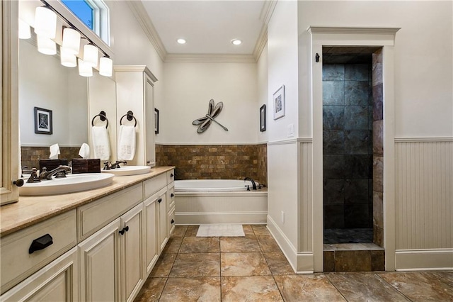 bathroom with ornamental molding, vanity, and plus walk in shower