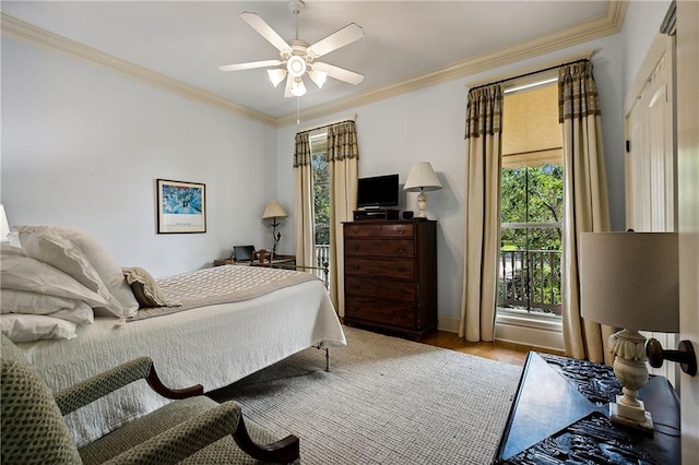 bedroom featuring ornamental molding, ceiling fan, and hardwood / wood-style floors