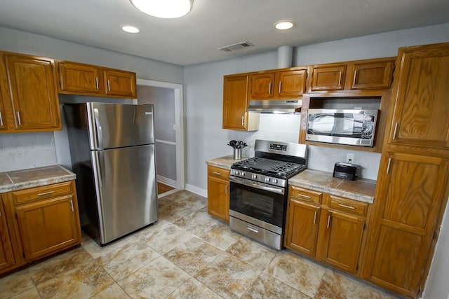 kitchen featuring decorative backsplash and stainless steel appliances