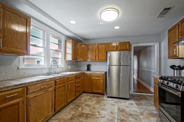 kitchen featuring stainless steel appliances and sink