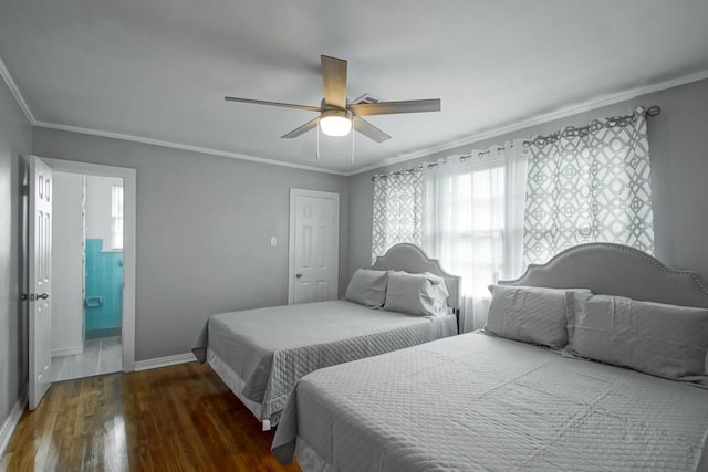 bedroom featuring multiple windows, crown molding, ceiling fan, and dark wood-type flooring