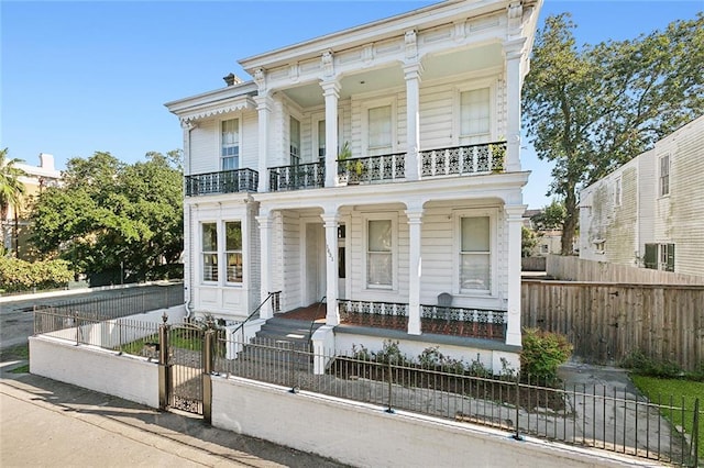 view of front of house with a balcony and a porch