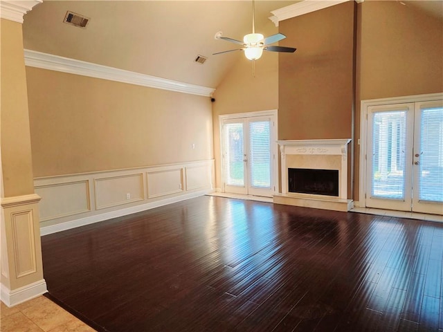 unfurnished living room featuring ceiling fan, ornamental molding, lofted ceiling, and french doors