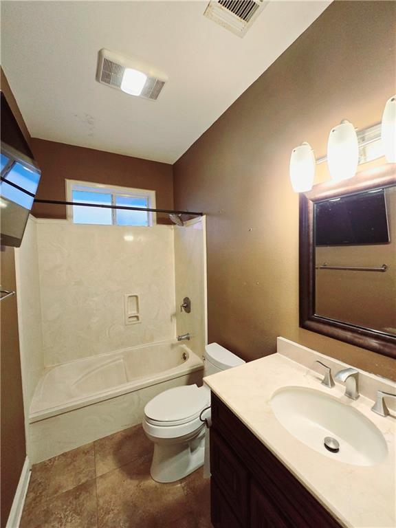 full bathroom with shower / bathing tub combination, vanity, and toilet