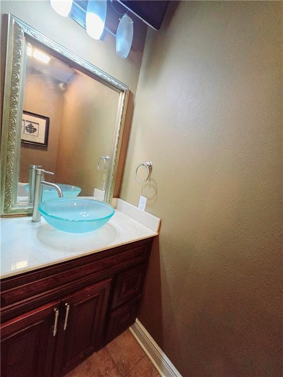 bathroom with tile patterned floors and vanity