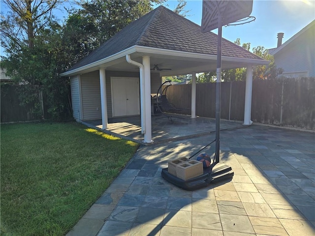 view of patio featuring ceiling fan and a gazebo