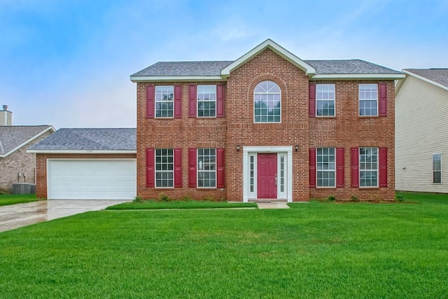 colonial home featuring a front yard, brick siding, an attached garage, a shingled roof, and concrete driveway