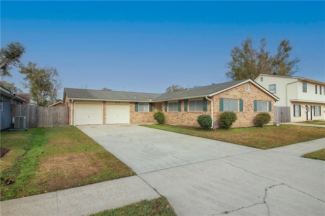 ranch-style home featuring a front yard and a garage