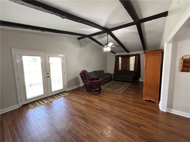 unfurnished living room with lofted ceiling with beams, french doors, dark hardwood / wood-style flooring, and ceiling fan