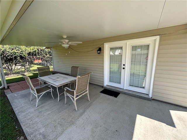 view of patio / terrace featuring ceiling fan and french doors