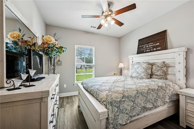 bedroom featuring dark hardwood / wood-style floors and ceiling fan