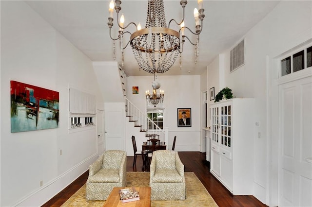 interior space with dark hardwood / wood-style flooring and an inviting chandelier