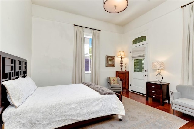 bedroom featuring dark wood-type flooring