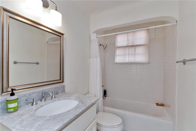 full bathroom with shower / tub combo, vanity, and toilet