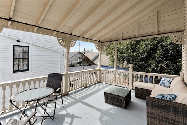 wooden terrace featuring an outdoor hangout area