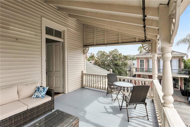 wooden deck with an outdoor hangout area