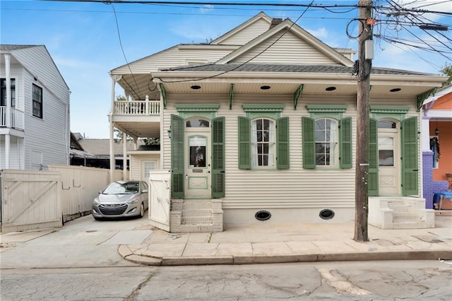 view of front of property with a balcony