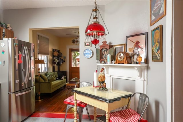 dining area with dark hardwood / wood-style floors and ceiling fan