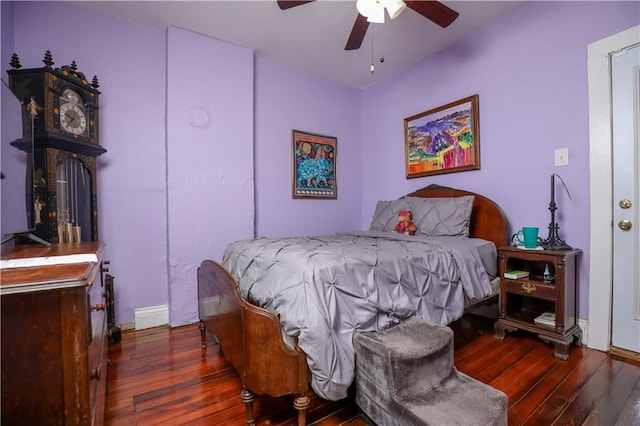 bedroom featuring ceiling fan and dark hardwood / wood-style flooring