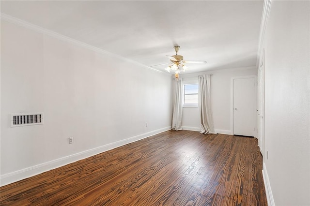 unfurnished room featuring ceiling fan, dark hardwood / wood-style floors, and crown molding