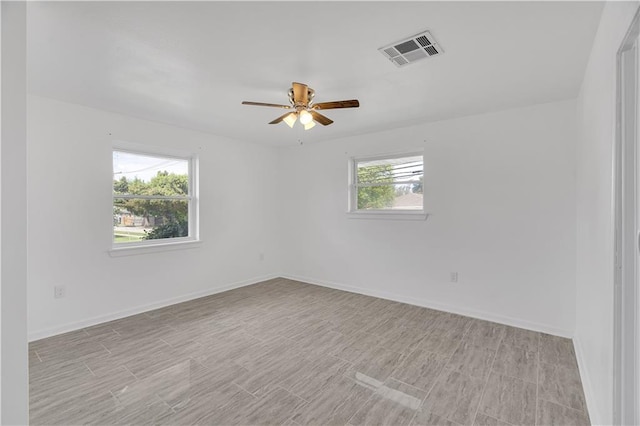 spare room with ceiling fan