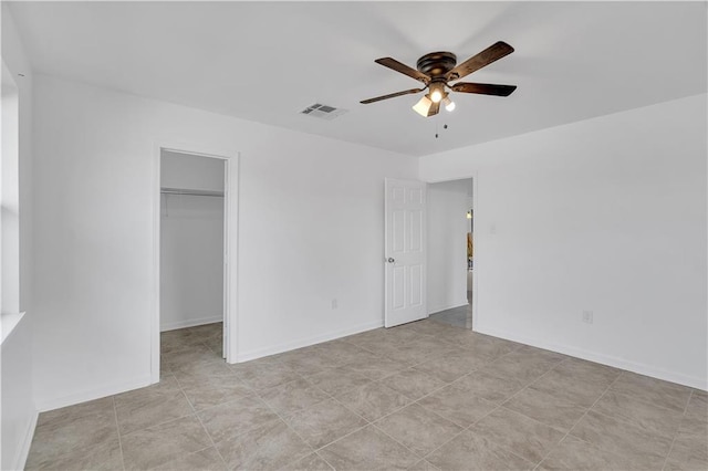 3244 Iowa Ave, Kenner, LA 70065 - unfurnished bedroom featuring a closet, a spacious closet, ceiling fan, baseboards, and visible vents