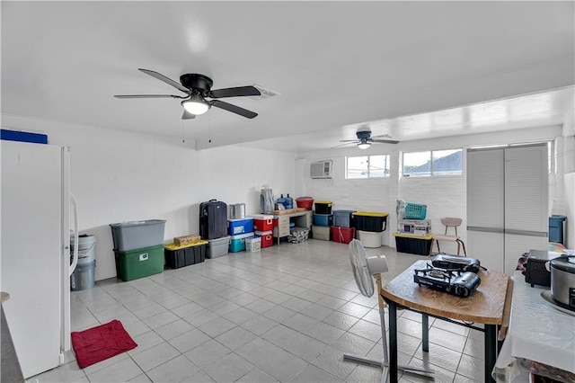 3244 Iowa Ave, Kenner, LA 70065 - office area featuring a wall mounted air conditioner, a ceiling fan, and tile patterned floors