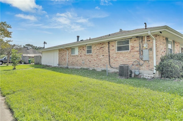 rear view of house featuring a lawn