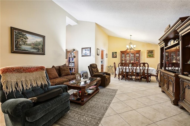 living room with light tile patterned floors, a textured ceiling, an inviting chandelier, and vaulted ceiling