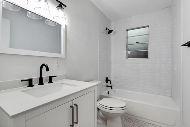 full bathroom with tiled shower / bath combo, vanity, and toilet