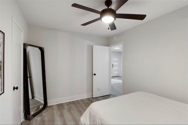 bedroom featuring ceiling fan and light hardwood / wood-style floors