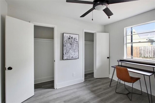 interior space with ceiling fan and hardwood / wood-style flooring