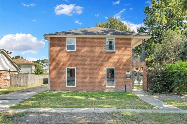 3730 Huntlee Dr, New Orleans, LA 70131 - view of side of property featuring a gate and brick siding