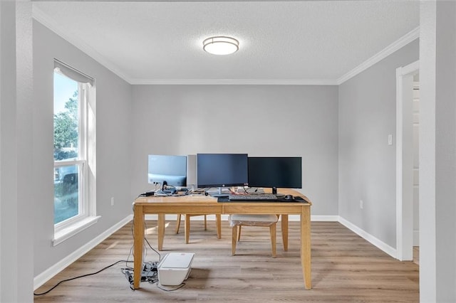 office area with wood-type flooring, plenty of natural light, and crown molding