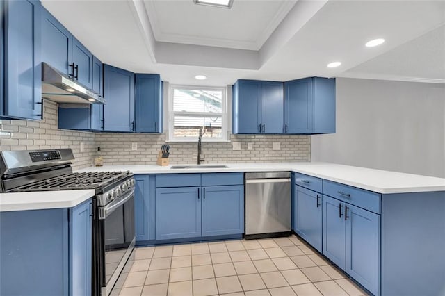 3730 Huntlee Dr, New Orleans, LA 70131 - kitchen featuring stainless steel appliances, a sink, under cabinet range hood, blue cabinets, and ornamental molding