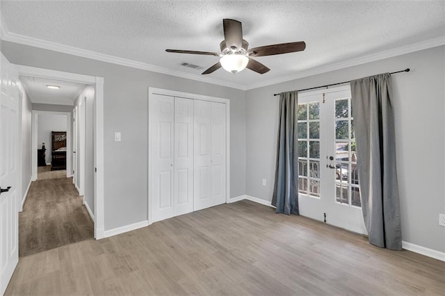 3730 Huntlee Dr, New Orleans, LA 70131 - unfurnished bedroom featuring light wood-style flooring, a textured ceiling, ornamental molding, baseboards, and ceiling fan