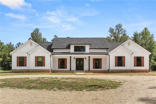 modern farmhouse style home with a front yard