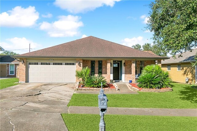 single story home with a garage and a front yard