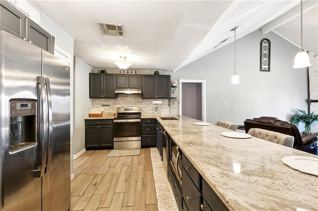 kitchen featuring sink, decorative light fixtures, light hardwood / wood-style flooring, stainless steel appliances, and light stone countertops