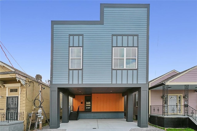 rear view of property featuring a carport