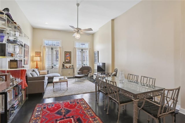 dining room with ceiling fan and french doors