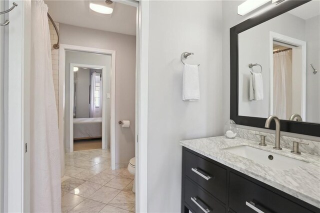 bathroom with vanity and toilet