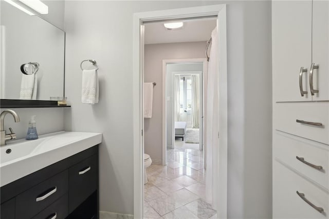 bathroom with vanity and toilet